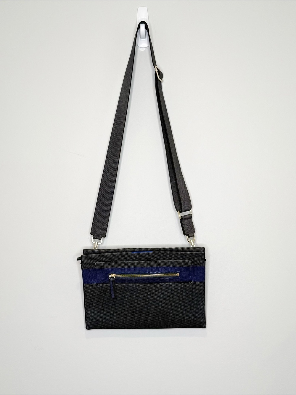 Rothy’s dark gray and blue fabric crossbody clutch or shoulder bag